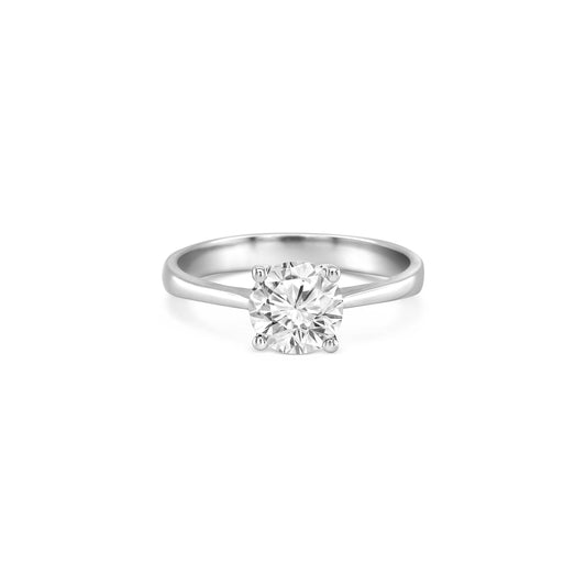 round brilliant solitaire diamond ring, solitaire engagement ring, classic diamond solitaire, round cut diamond ring, elegant diamond ring, timeless solitaire jewelry, women’s engagement ring, white gold solitaire ring, fine diamond jewelry, luxury solitaire diamond