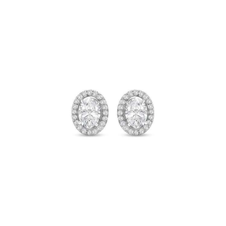 oval diamond halo earrings, diamond stud earrings, oval cut diamond jewelry, halo diamond earrings, elegant diamond studs, women’s fine jewelry, classic diamond earrings, oval halo stud earrings, luxury diamond jewelry, sparkling diamond earrings