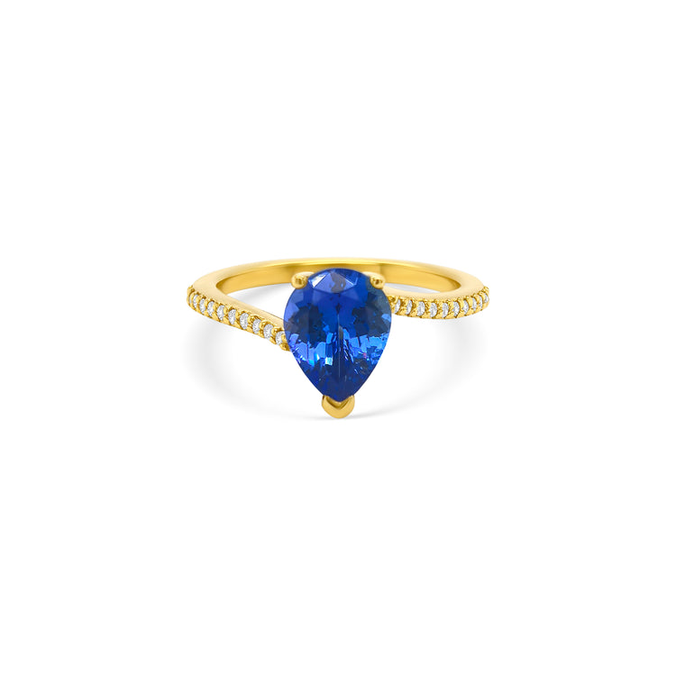 pear shape tanzanite ring, pear cut gemstone ring, tanzanite and diamond ring, elegant pear cut tanzanite jewelry, luxury gemstone ring, women’s tanzanite diamond ring, pear shaped engagement style ring, fine gemstone jewelry, white gold tanzanite and diamond ring, sparkling pear cut tanzanite ring