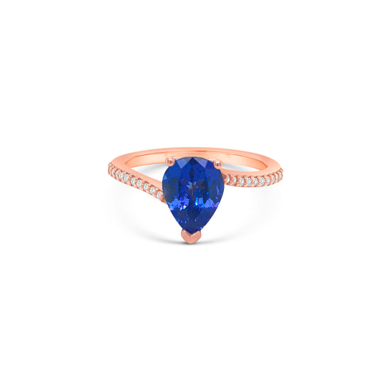 pear shape tanzanite ring, pear cut gemstone ring, tanzanite and diamond ring, elegant pear cut tanzanite jewelry, luxury gemstone ring, women’s tanzanite diamond ring, pear shaped engagement style ring, fine gemstone jewelry, white gold tanzanite and diamond ring, sparkling pear cut tanzanite ring