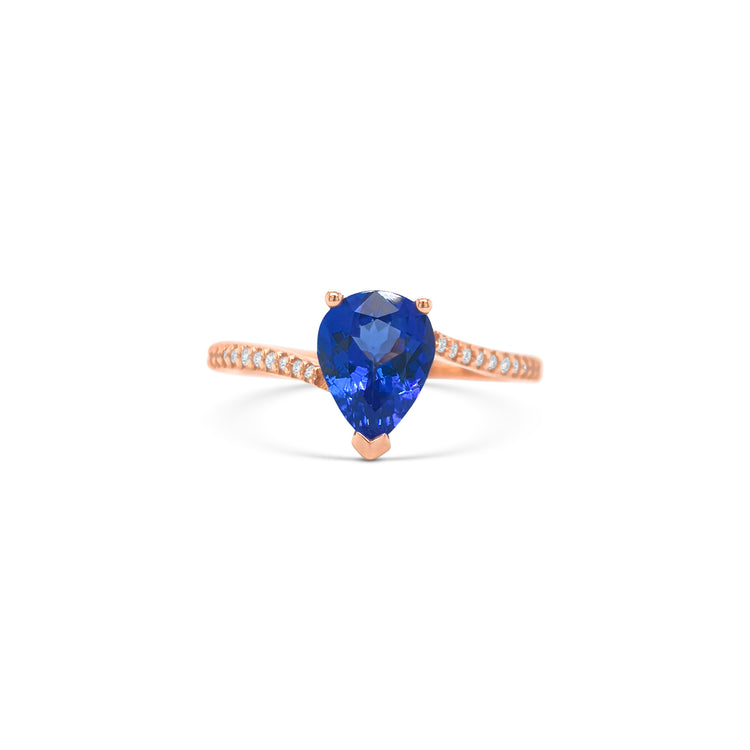 pear shape tanzanite ring, pear cut gemstone ring, tanzanite and diamond ring, elegant pear cut tanzanite jewelry, luxury gemstone ring, women’s tanzanite diamond ring, pear shaped engagement style ring, fine gemstone jewelry, white gold tanzanite and diamond ring, sparkling pear cut tanzanite ring