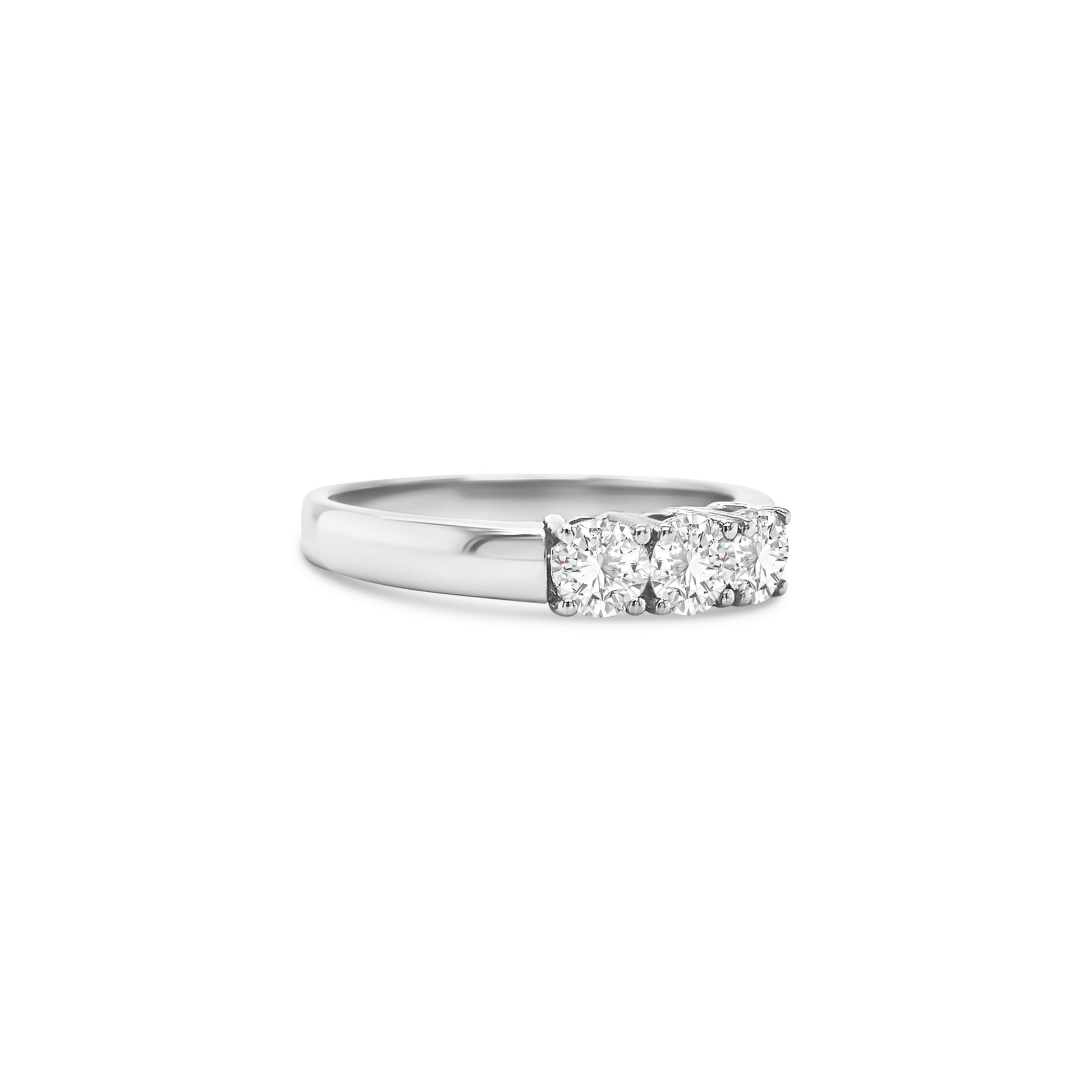 round brilliant diamond ring, trilogy diamond ring, white gold diamond ring, three stone diamond ring, white gold trilogy ring, round cut diamond ring, engagement trilogy ring, white gold engagement ring, classic diamond trilogy ring, bridal trilogy ring white gold