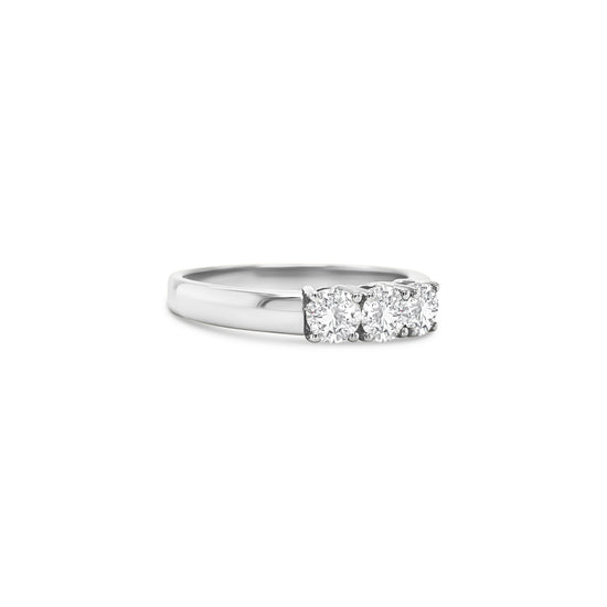 round brilliant diamond ring, trilogy diamond ring, white gold diamond ring, three stone diamond ring, white gold trilogy ring, round cut diamond ring, engagement trilogy ring, white gold engagement ring, classic diamond trilogy ring, bridal trilogy ring white gold