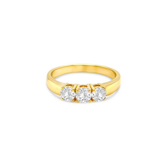round brilliant diamond ring, trilogy diamond ring, yellow gold diamond ring, three stone diamond ring, yellow gold trilogy ring, round cut diamond ring, engagement trilogy ring, yellow gold engagement ring, classic diamond trilogy ring, bridal trilogy ring yellow gold