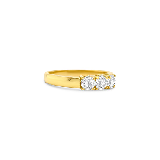 round brilliant diamond ring, trilogy diamond ring, yellow gold diamond ring, three stone diamond ring, yellow gold trilogy ring, round cut diamond ring, engagement trilogy ring, yellow gold engagement ring, classic diamond trilogy ring, bridal trilogy ring yellow gold
