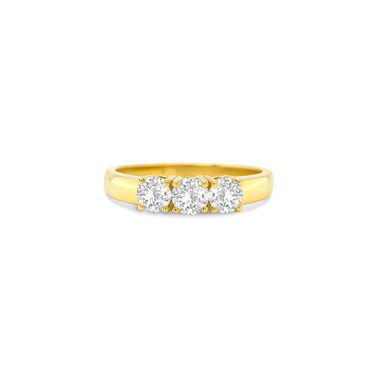 round brilliant diamond ring, trilogy diamond ring, yellow gold diamond ring, three stone diamond ring, yellow gold trilogy ring, round cut diamond ring, engagement trilogy ring, yellow gold engagement ring, classic diamond trilogy ring, bridal trilogy ring yellow gold