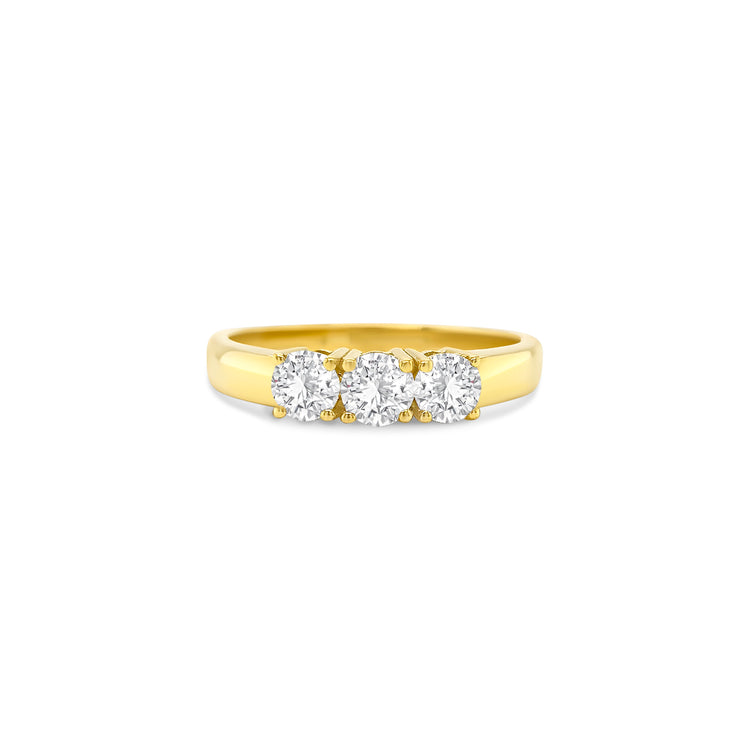 round brilliant diamond ring, trilogy diamond ring, yellow gold diamond ring, three stone diamond ring, yellow gold trilogy ring, round cut diamond ring, engagement trilogy ring, yellow gold engagement ring, classic diamond trilogy ring, bridal trilogy ring yellow gold
