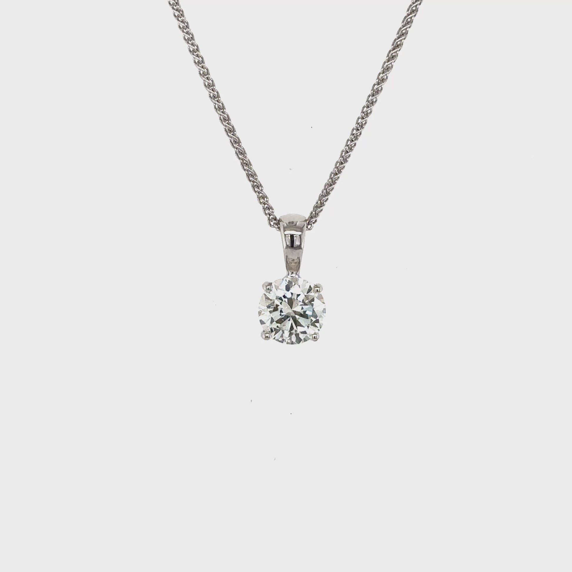 round brilliant diamond pendant, solitaire diamond necklace, classic diamond jewelry, round cut diamond pendant, elegant diamond pendant, fine jewelry necklace, timeless diamond pendant, white gold solitaire pendant, luxury diamond necklace, women’s diamond jewelry