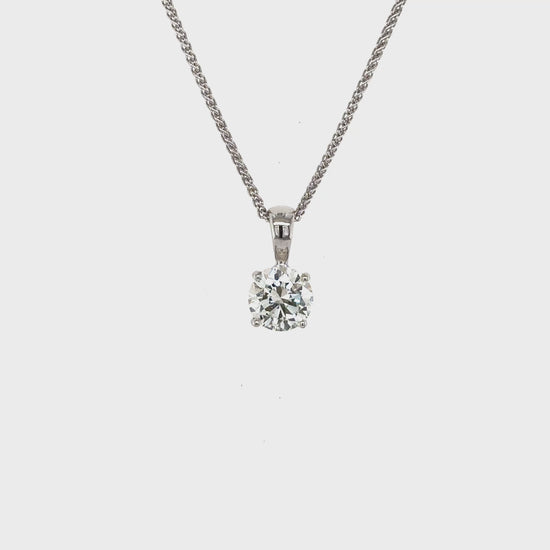 round brilliant diamond pendant, solitaire diamond necklace, classic diamond jewelry, round cut diamond pendant, elegant diamond pendant, fine jewelry necklace, timeless diamond pendant, white gold solitaire pendant, luxury diamond necklace, women’s diamond jewelry