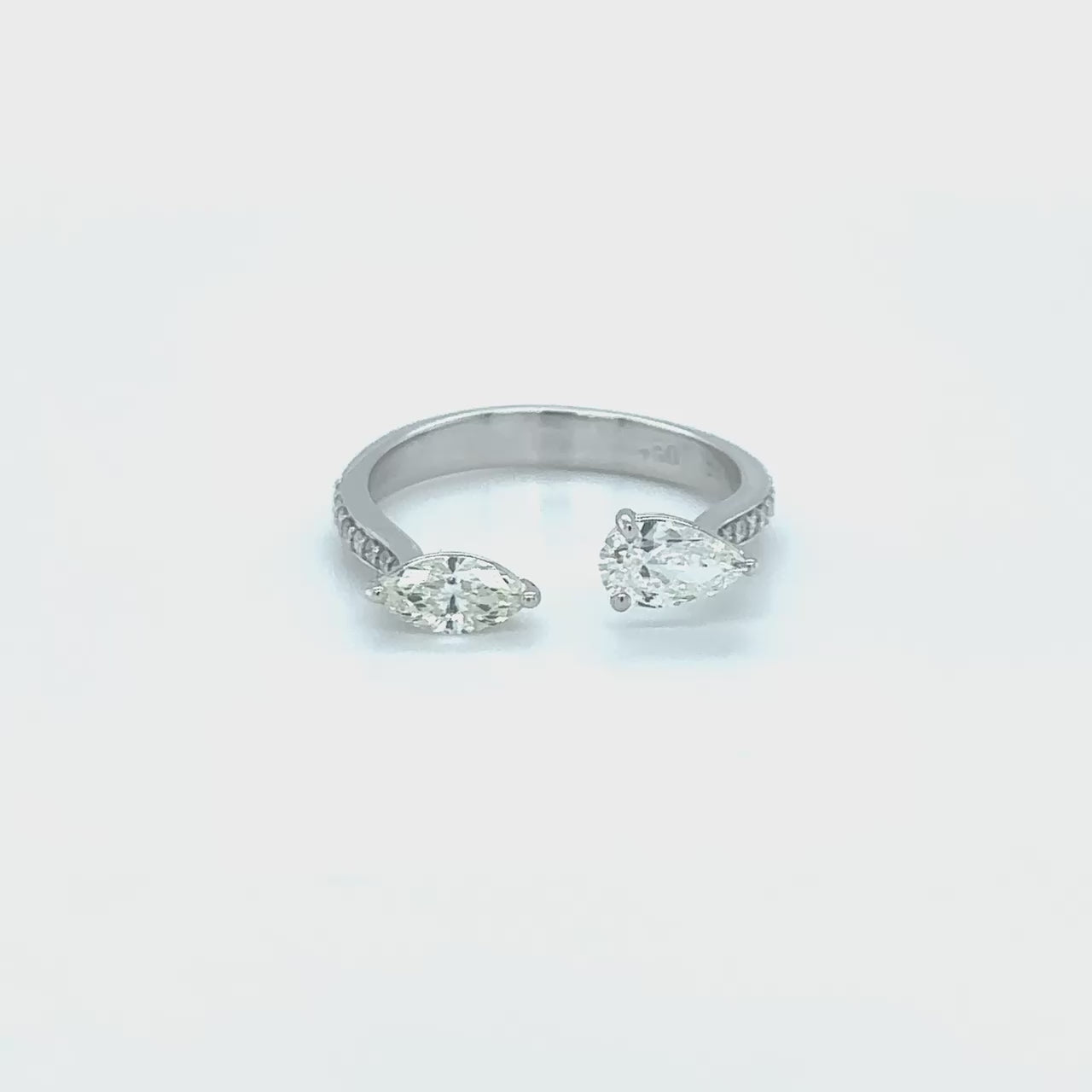 "Two stone diamond ring, Pear cut diamond ring, Marquise cut diamond ring, Diamond engagement ring, Diamond anniversary ring, Two stone engagement ring, Pear and Marquise cut diamond ring, Two stone wedding ring, Pear and Marquise cut diamond anniversary ring, Dual stone diamond ring."