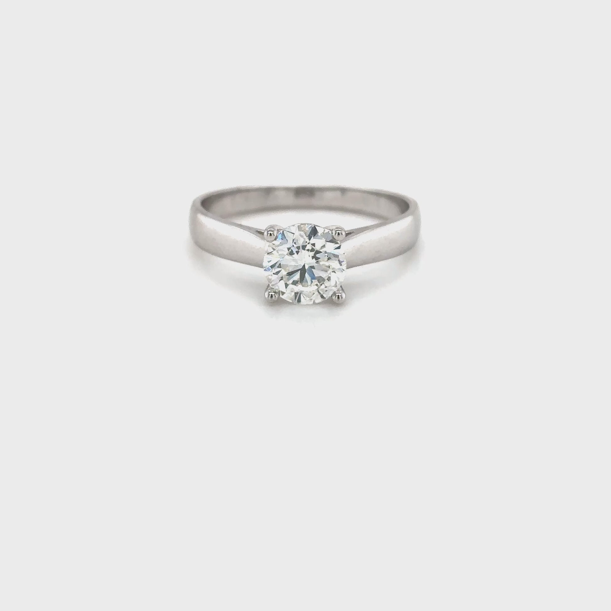 round brilliant solitaire diamond ring, solitaire engagement ring, classic diamond solitaire, round cut diamond ring, elegant diamond ring, timeless solitaire jewelry, women’s engagement ring, white gold solitaire ring, fine diamond jewelry, luxury solitaire diamond
