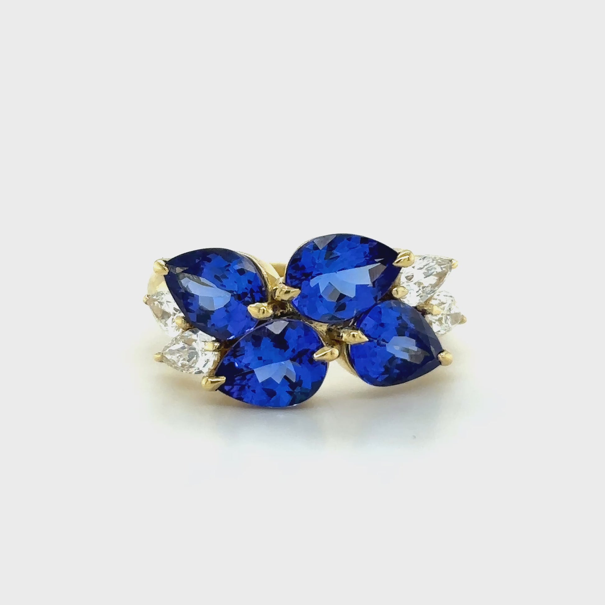 Cluster ring with pear-shaped tanzanite and matching diamond accents
