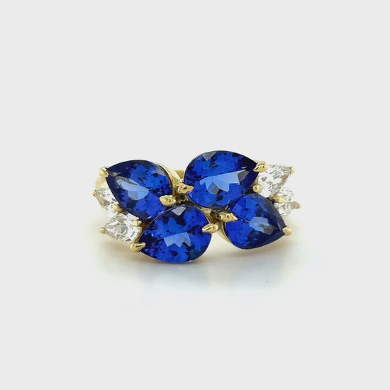 Cluster ring with pear-shaped tanzanite and matching diamond accents