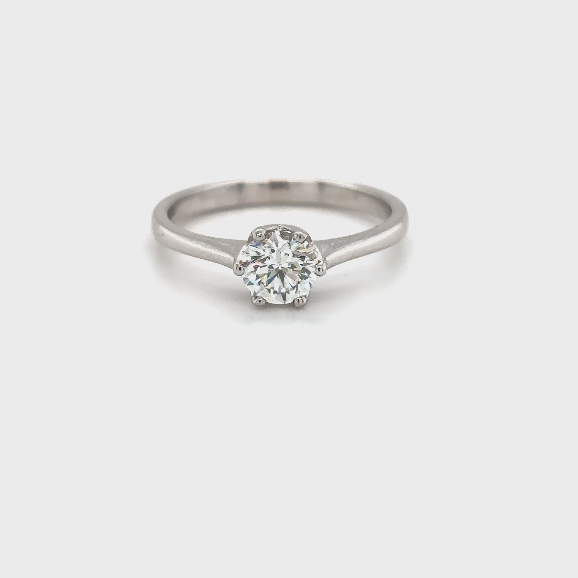 Solitaire round brilliant diamond ring, Classic solitaire engagement ring with round brilliant cut, Elegant round brilliant cut diamond solitaire in white gold, Timeless round diamond solitaire ring setting, Minimalist solitaire ring featuring round brilliant diamond, Round brilliant solitaire engagement ring in prong setting, Dainty round diamond solitaire ring for engagement or special occasions