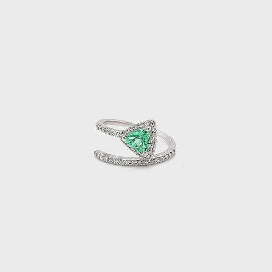 Trillion cut tourmaline ring, diamond accent ring, exquisite gemstone jewelry, luxurious trillion cut ring, vibrant tourmaline centerpiece, sparkling diamond embellishments, elegant gemstone and diamond ring, stunning trillion cut tourmaline, dazzling diamond accents, opulent tourmaline and diamond jewelry.