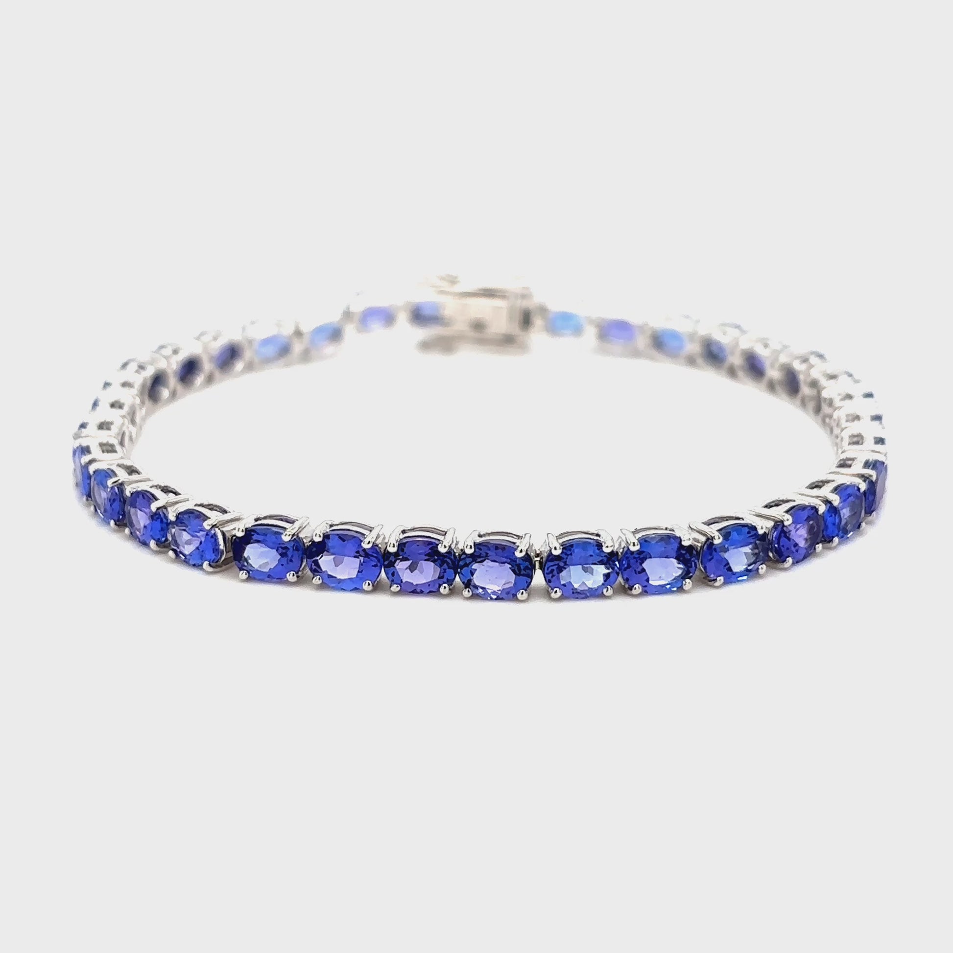 "Oval Cut Tanzanite Tennis Bracelet," "Tanzanite Tennis Bracelet," "Fine Jewelry," "Luxury Bracelet," "Fashion Bracelet," "Gemstone Jewelry," "Sparkling Tanzanite Bracelet," "Statement Bracelet," "Elegant Jewelry," "Special Occasion Bracelet," "Tanzanite Jewelry," "Timeless Jewelry," "Handcrafted Bracelet," "Unique Gemstone Bracelet," "Classic Tennis Bracelet."