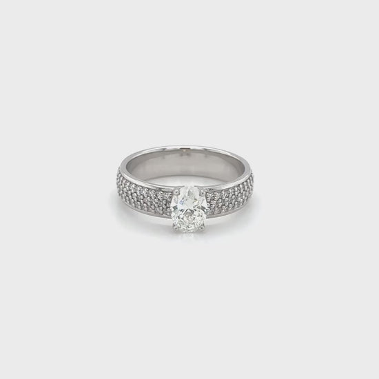 Oval diamond band, round brilliant diamond band, elegant diamond ring, sparkling gemstone band, fine jewelry accessory, diamond-studded band, stylish oval and round diamonds, luxurious diamond ring, exquisite gemstone band.