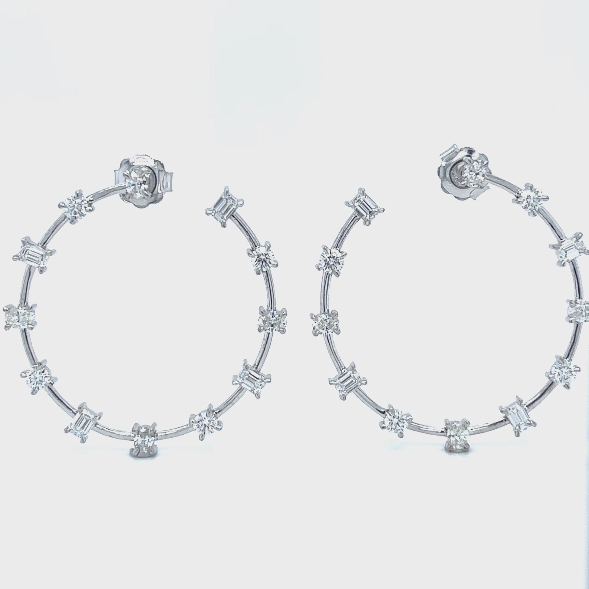 "Round Brilliant Oval & Emerald Cut Diamond Hoop Earrings," "Luxury Diamond Hoop Earrings with Round Oval and Emerald Cuts," "Elegant Multi Shape Diamond Hoop Earrings," "Round Brilliant Diamond Hoop Earrings," "Oval Cut Diamond Hoop Earrings," "Emerald Cut Diamond Hoop Earrings," "Exquisite Multi Cut Diamond Hoop Earrings," "Fine Jewelry Diamond Hoop Earrings Multi Shapes," "Unique Round Oval Emerald Cut Diamond Hoop Earrings," "Sparkling Diamond Hoop Earrings with Round Brilliant Oval and Emerald Cuts."