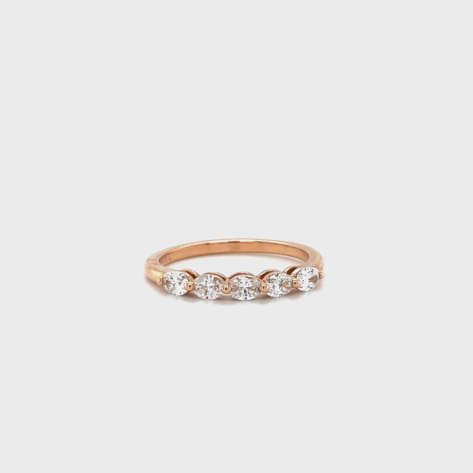 Oval cut diamond ring, half eternity band, sparkling jewelry, elegant design, luxurious accessory, timeless beauty, glamorous style, stunning craftsmanship, dazzling diamonds, exquisite detailing.