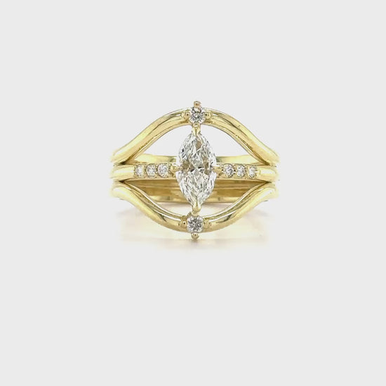 "Marquise Cut Diamond Ring," "Diamond Engagement Ring," "Marquise Diamond Ring," "Fine Jewelry," "Luxury Ring," "Fashion Ring," "Sparkling Diamond Ring," "Statement Ring," "Elegant Jewelry," "Special Occasion Ring," "Diamond Jewelry," "Timeless Jewelry," "Handcrafted Ring," "Unique Diamond Ring," "Classic Marquise Ring."