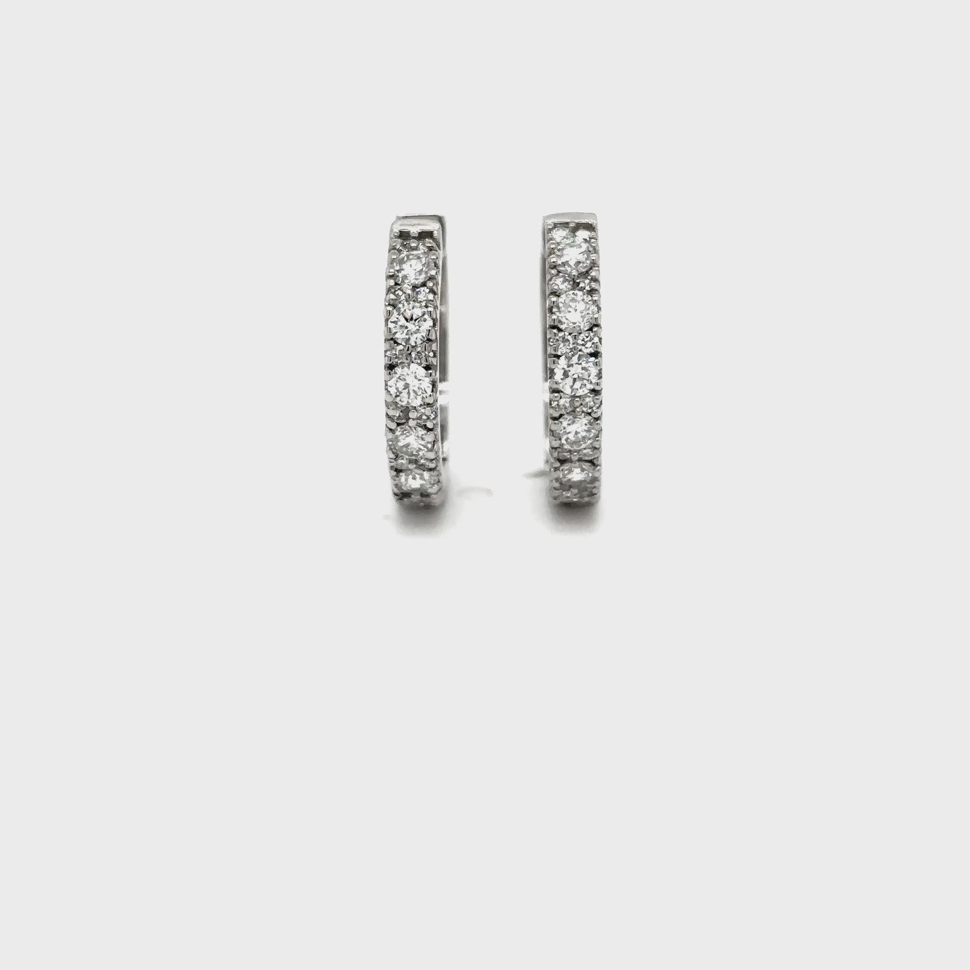 Round brilliant diamond huggy earrings, diamond huggie hoop earrings, elegant diamond huggy earrings, classic round brilliant cut earrings, fine jewelry diamond huggies, luxury diamond earrings for women, timeless diamond hoop earrings, everyday diamond huggy hoops, designer round brilliant earrings, white gold diamond huggie earrings.
