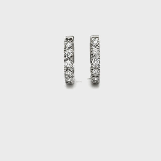 Round brilliant diamond huggy earrings, diamond huggie hoop earrings, elegant diamond huggy earrings, classic round brilliant cut earrings, fine jewelry diamond huggies, luxury diamond earrings for women, timeless diamond hoop earrings, everyday diamond huggy hoops, designer round brilliant earrings, white gold diamond huggie earrings.