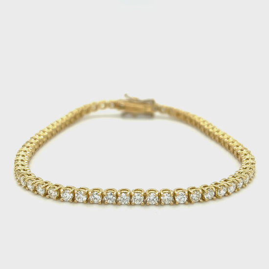 "Classic Diamond Tennis Bracelet with round brilliant diamonds", "Elegant tennis bracelet featuring a continuous row of diamonds", "Close-up of Diamond Tennis Bracelet clasp and setting", "Luxury Diamond Tennis Bracelet in white gold", "Sparkling Diamond Tennis Bracelet for everyday elegance"