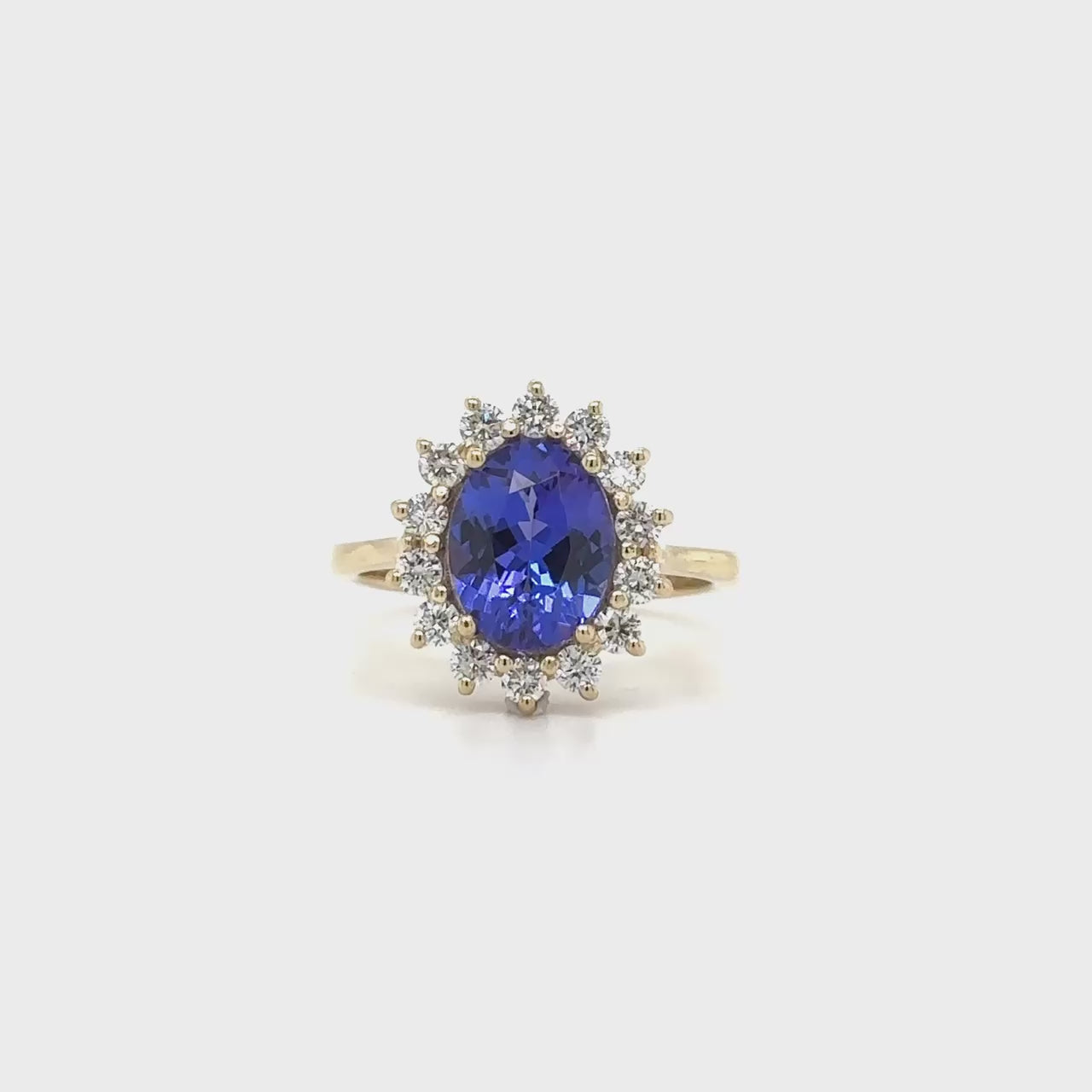 Oval Solitaire Tanzanite Floral Diamond Halo Ring, Oval Tanzanite Solitaire Ring, Floral Diamond Halo Tanzanite Ring, Luxury Tanzanite Diamond Ring, Oval Cut Tanzanite Engagement Ring, Fine Jewelry Tanzanite Ring, Elegant Oval Tanzanite Diamond Ring, Tanzanite Floral Design Halo Ring