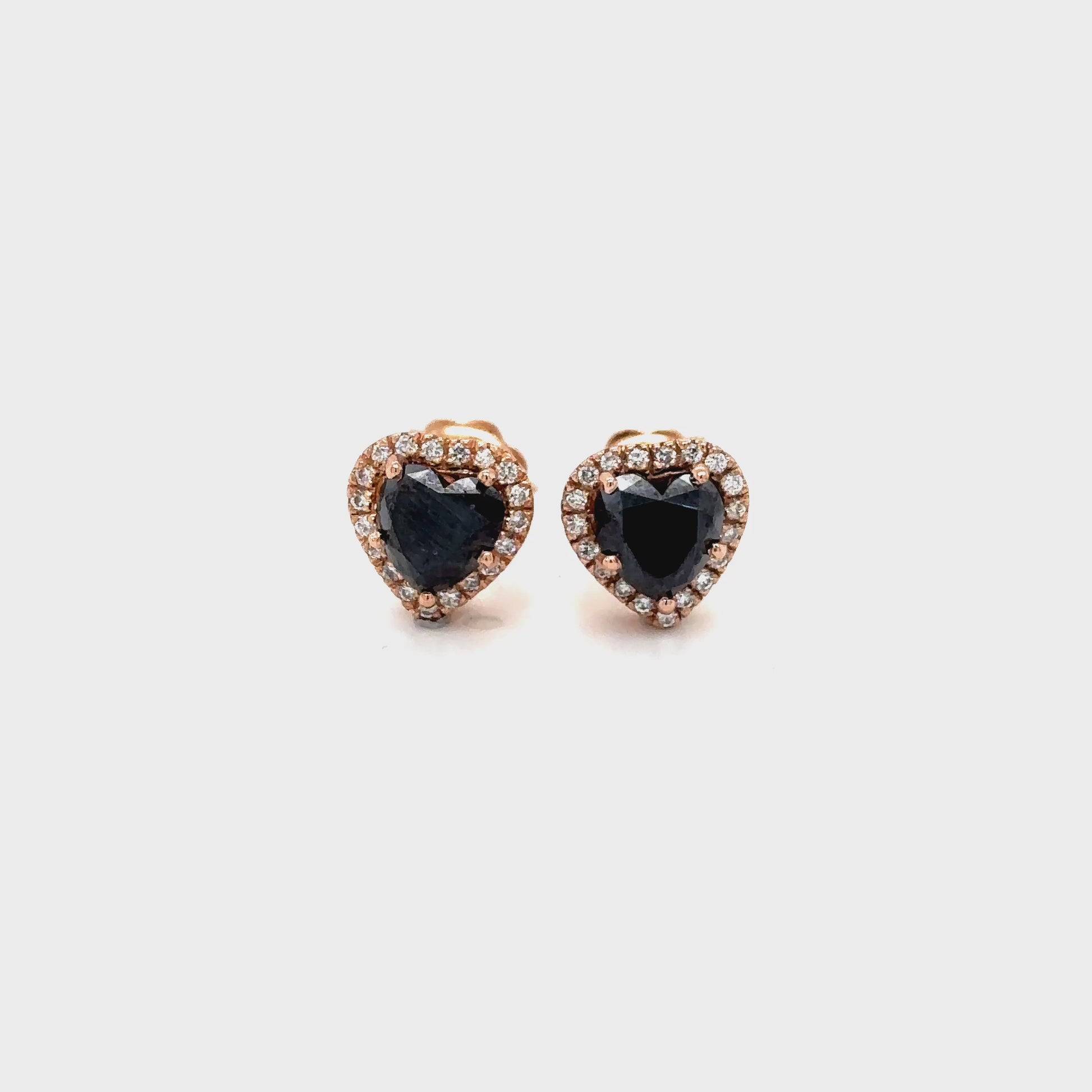 heart shaped black diamond earrings, black diamond halo studs, white diamond halo earrings, black and white diamond earrings, heart black diamond studs, luxury diamond stud earrings, black diamond earrings for women, heart shaped earrings, black diamond jewelry, white diamond accent earrings