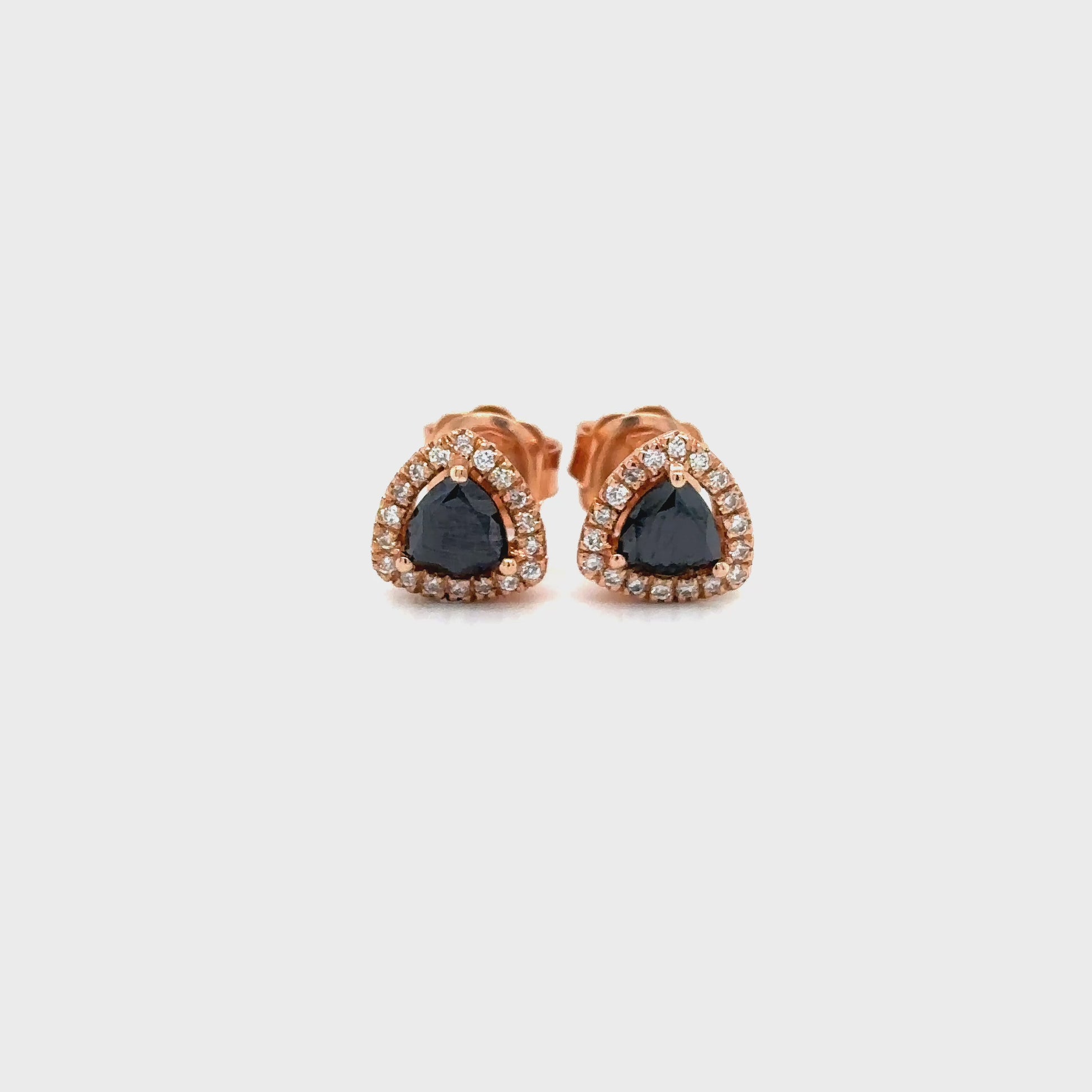 trillion black diamond earrings, black diamond halo studs, white diamond halo earrings, black and white diamond earrings, trillion cut diamond studs, black diamond stud earrings, black diamond jewelry, white diamond accent earrings, luxury black diamond earrings, geometric diamond earrings