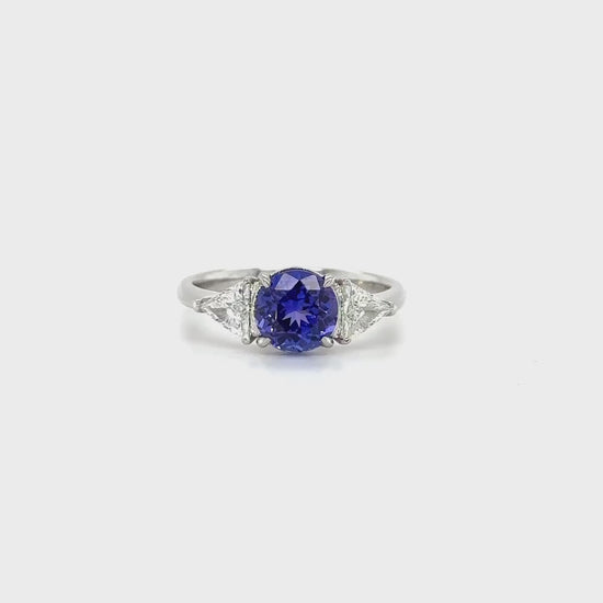 "Round Cut Tanzanite & Diamond Ring," "Exquisite Round Cut Tanzanite Ring," "Luxurious Diamond Jewelry with Round Cut Tanzanite," "Elegant Round Cut Gemstone Ring," "Fine Jewelry featuring Round Cut Tanzanite and Diamonds," "High-Quality Round Cut Tanzanite Ring," "Statement Round Cut Gemstone and Diamond Ring," "Sparkling Tanzanite and Diamond Jewelry with Round Cut," "Beautiful Round Cut Gemstone Ring," "Fashionable Tanzanite & Diamond Ring with Round Cut."