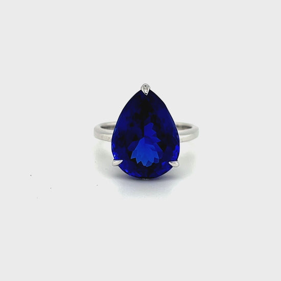 Alt tag: "Pear-Shaped Tanzanite Solitaire Ring" Alt tag: "11.30ct Tanzanite Gemstone Ring" Alt tag: "Luxury Violet-Blue Tanzanite Jewelry" Alt tag: "Elegant Pear-Cut Solitaire Ring" Alt tag: "Genuine Tanzanite Engagement Ring" Alt tag: "Fine Jewelry with Lustrous Metal Band" Alt tag: "Statement Tanzanite Accessory"