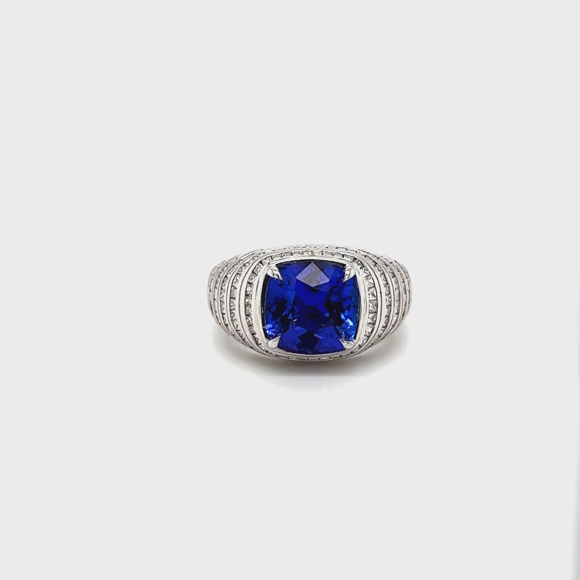 "Square Cushion Cut Tanzanite & Princess Cut Diamond Ring," "Luxury Cushion Cut Tanzanite and Princess Diamond Ring," "Elegant Square Cushion Tanzanite & Diamond Engagement Ring," "Square Cushion Tanzanite with Princess Cut Diamond Ring," "Exquisite Cushion Cut Tanzanite and Princess Diamond Ring," "Fine Jewelry Square Cushion Tanzanite & Princess Diamond Ring," "Unique Square Cushion Tanzanite Princess Cut Diamond Ring," "Beautiful Cushion Cut Tanzanite with Princess Diamonds," "Timeless Square Cushion Tan