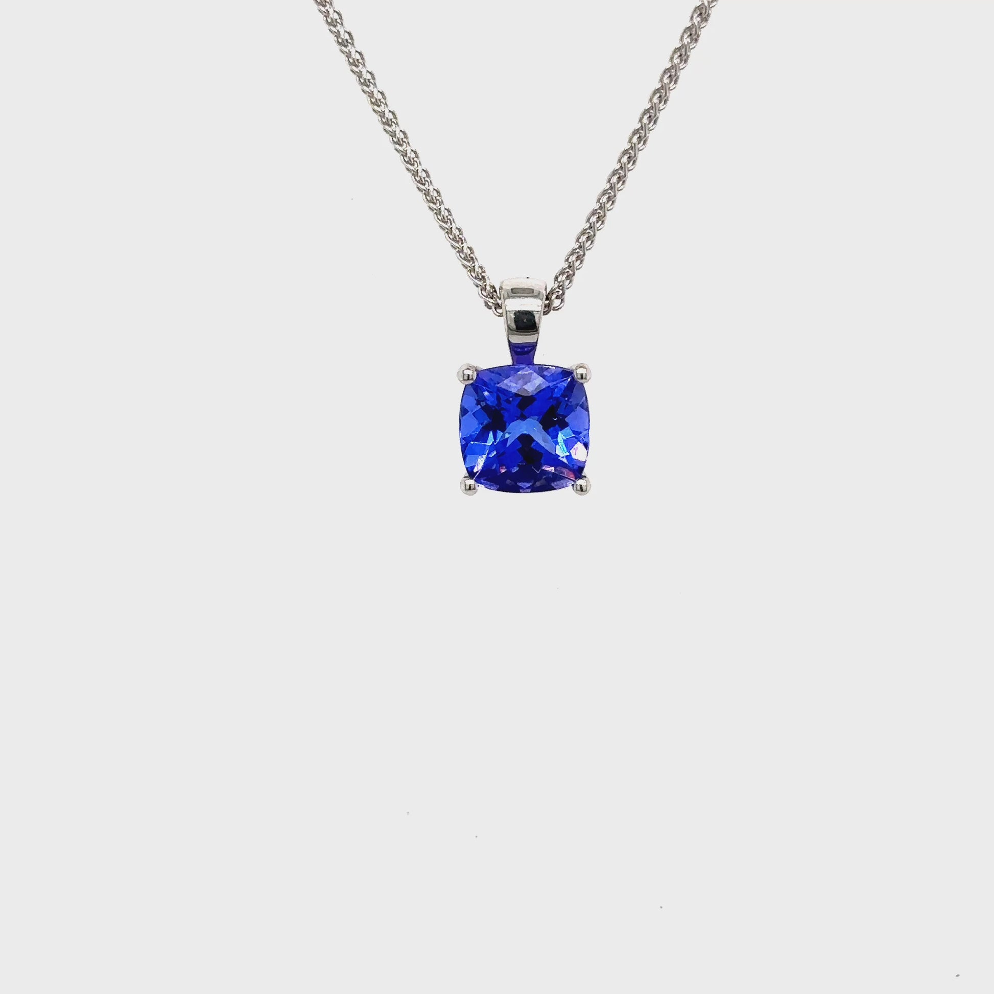 cushion cut tanzanite pendant, blue gemstone necklace, white gold pendant necklace, tanzanite solitaire necklace, elegant gemstone pendant, cushion cut sapphire necklace, minimalist necklace with blue stone, tanzanite jewelry, white gold gemstone chain, cushion cut blue stone necklace
