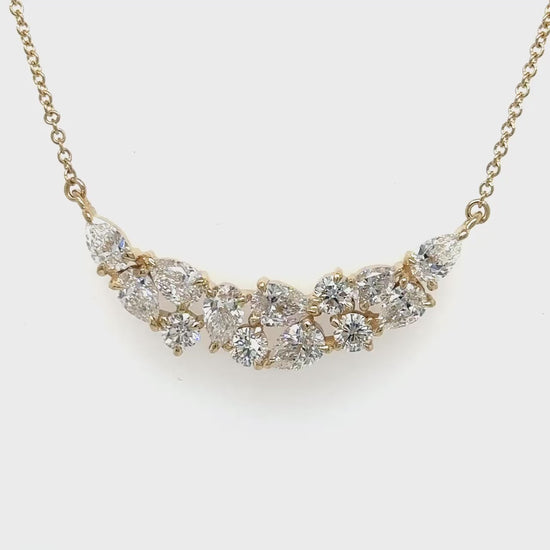 A round brilliant diamond pendant, sparkling round brilliant pendant, elegant round pendant, pear-shaped diamond pendant, dazzling pear pendant, pear-shaped drop pendant.
