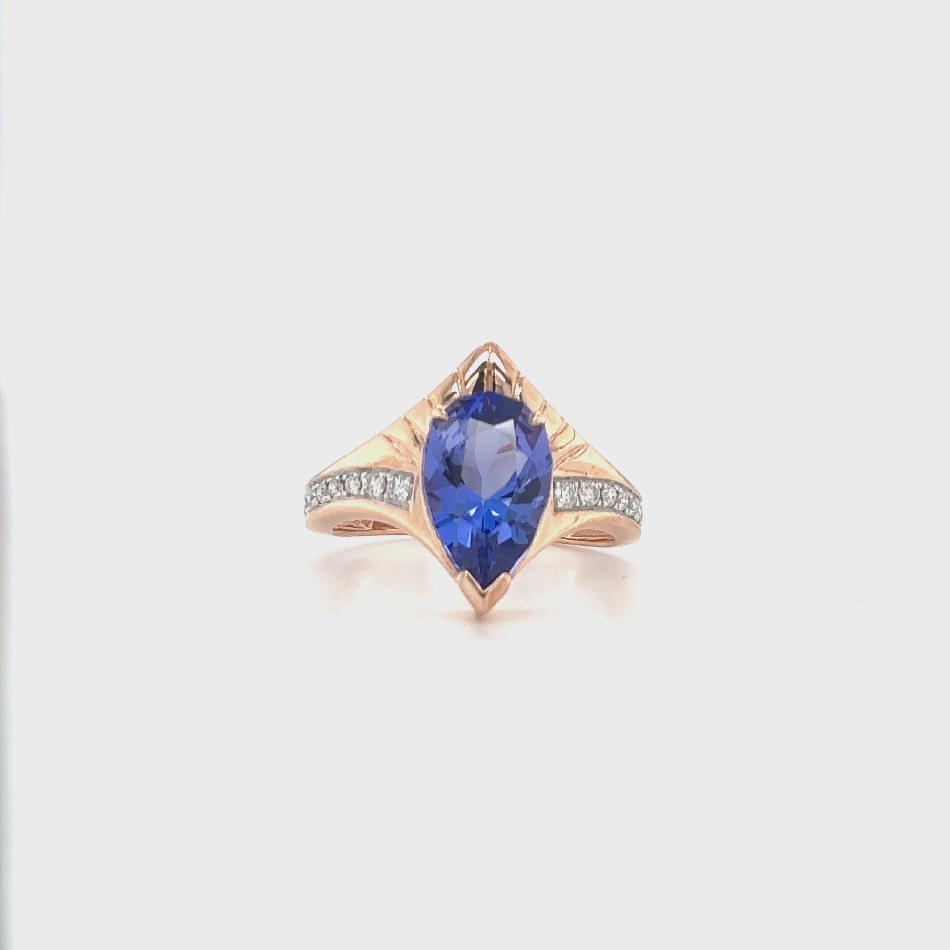 "Pear Shaped Tanzanite Ring, Tanzanite and Diamond Ring, Pear Cut Tanzanite Jewelry, Blue Gemstone Ring, Pear Shaped Engagement Ring, Tanzanite Ring with Diamonds, Pear Shaped Blue Stone Ring, Elegant Tanzanite Diamond Ring, Pear Shaped Tanzanite and Diamond Ring."