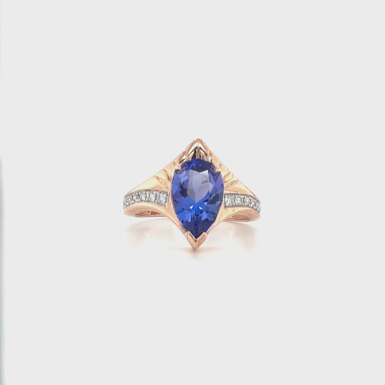 "Pear Shaped Tanzanite Ring, Tanzanite and Diamond Ring, Pear Cut Tanzanite Jewelry, Blue Gemstone Ring, Pear Shaped Engagement Ring, Tanzanite Ring with Diamonds, Pear Shaped Blue Stone Ring, Elegant Tanzanite Diamond Ring, Pear Shaped Tanzanite and Diamond Ring."