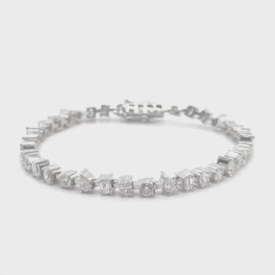 "Multi-Shaped Diamond Tennis Bracelet," "Diamond Tennis Bracelet," "Fine Jewelry," "Luxury Bracelet," "Fashion Bracelet," "Diamond Jewelry," "Sparkling Tennis Bracelet," "Statement Bracelet," "Elegant Jewelry," "Special Occasion Bracelet," "Multi-Cut Diamond Bracelet," "Timeless Jewelry," "Handcrafted Diamond Bracelet," "Versatile Diamond Bracelet," "Designer Tennis Bracelet."
