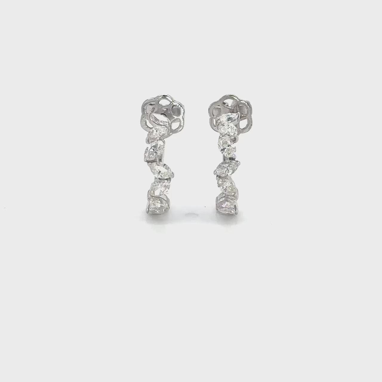 Oval cut diamond hoop earrings, elegant oval diamond hoops, sparkling oval diamond earrings, luxury diamond hoop earrings, oval diamond jewelry, fine diamond hoop earrings, oval cut diamond accessories, glamorous diamond hoop earrings, oval diamond ear hoops, sophisticated oval diamond earrings, timeless oval cut diamond hoops, stylish diamond hoop earrings, exquisite oval diamond earrings, high-end oval diamond hoops, fashionable oval cut diamond earrings.