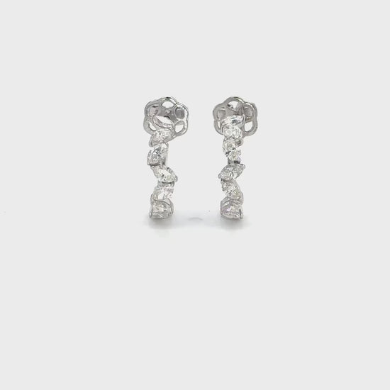 Oval cut diamond hoop earrings, elegant oval diamond hoops, sparkling oval diamond earrings, luxury diamond hoop earrings, oval diamond jewelry, fine diamond hoop earrings, oval cut diamond accessories, glamorous diamond hoop earrings, oval diamond ear hoops, sophisticated oval diamond earrings, timeless oval cut diamond hoops, stylish diamond hoop earrings, exquisite oval diamond earrings, high-end oval diamond hoops, fashionable oval cut diamond earrings.