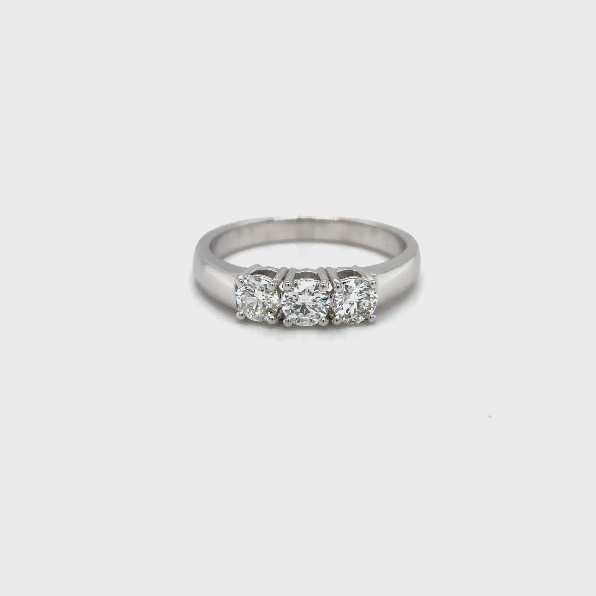 round brilliant diamond ring, trilogy diamond ring, white gold diamond ring, three stone diamond ring, white gold trilogy ring, round cut diamond ring, engagement trilogy ring, white gold engagement ring, classic diamond trilogy ring, bridal trilogy ring white gold