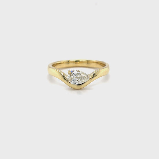 pear shaped diamond ring, yellow gold solitaire ring, bypass engagement ring, east-west diamond solitaire, modern pear diamond ring