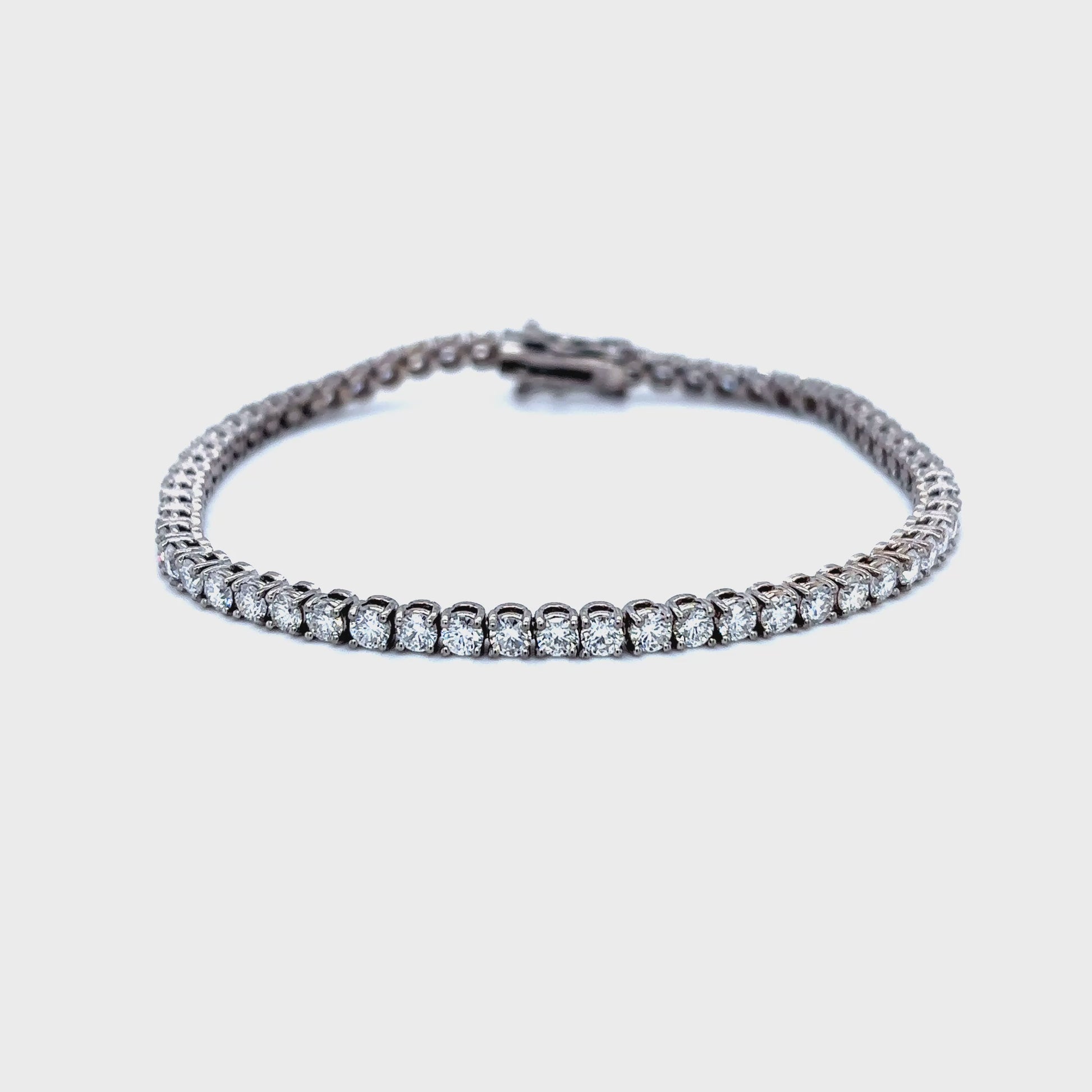 Diamond tennis bracelet, classic diamond bracelet, elegant diamond line bracelet, round brilliant cut diamond bracelet, fine jewelry tennis bracelet, luxury diamond bracelet for women, timeless diamond jewelry, designer tennis bracelet, white gold diamond bracelet, everyday diamond bracelet.