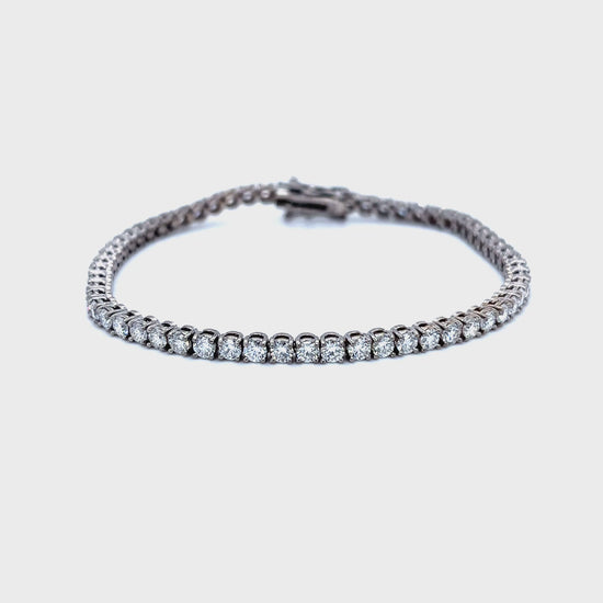 Diamond tennis bracelet, classic diamond bracelet, elegant diamond line bracelet, round brilliant cut diamond bracelet, fine jewelry tennis bracelet, luxury diamond bracelet for women, timeless diamond jewelry, designer tennis bracelet, white gold diamond bracelet, everyday diamond bracelet.