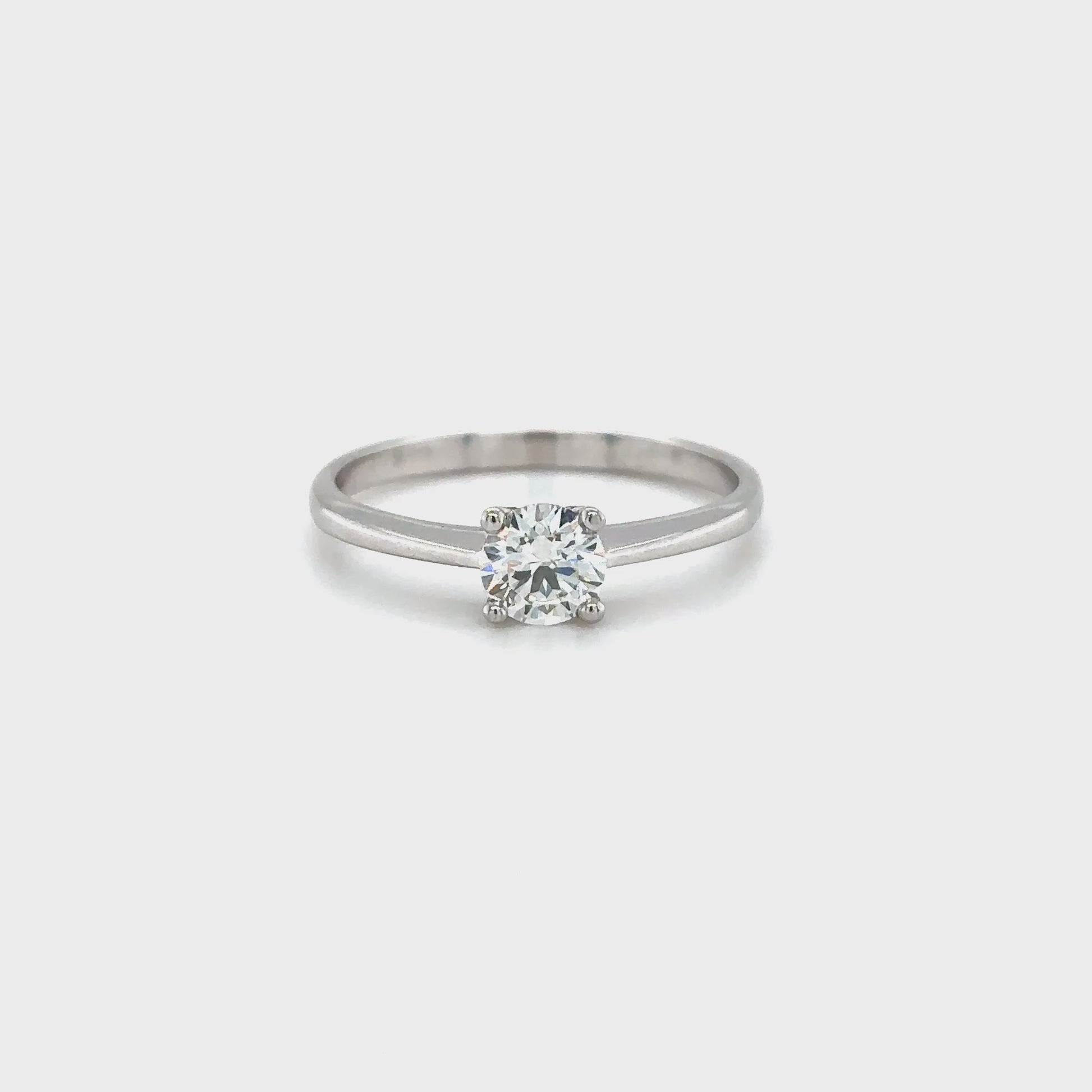 Solitaire round brilliant diamond ring, Classic solitaire engagement ring with round brilliant cut, Elegant round brilliant cut diamond solitaire in white gold, Timeless round diamond solitaire ring setting, Minimalist solitaire ring featuring round brilliant diamond, Round brilliant solitaire engagement ring in prong setting, Dainty round diamond solitaire ring for engagement or special occasions