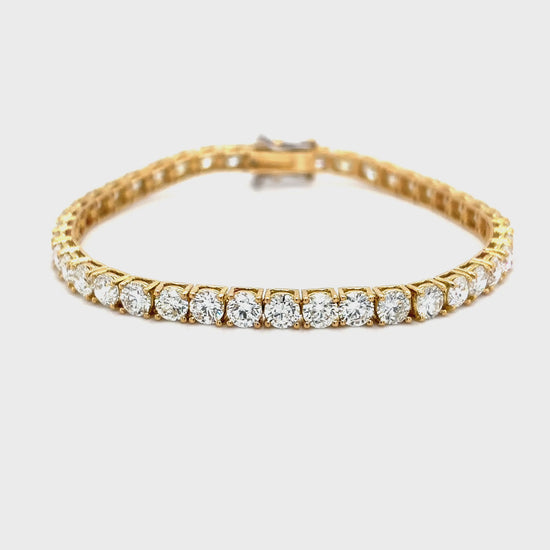 "Classic Diamond Tennis Bracelet with round brilliant diamonds", "Elegant tennis bracelet featuring a continuous row of diamonds", "Close-up of Diamond Tennis Bracelet clasp and setting", "Luxury Diamond Tennis Bracelet in white gold", "Sparkling Diamond Tennis Bracelet for everyday elegance"