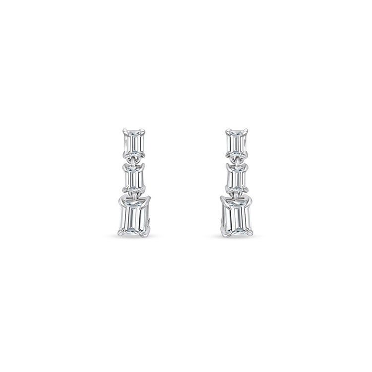 Emerald Cut Diamond Drop Earrings, sophisticated jewelry, elegant diamond earrings, sparkling gemstone drops, luxurious emerald-cut design, exquisite jewelry accessories, statement earrings, fine craftsmanship, glamorous diamond jewelry, radiant gemstone drops, timeless and refined style.