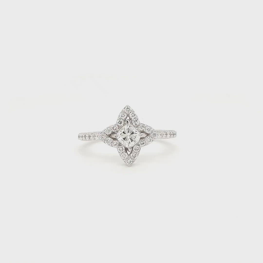 "Cushion Cut Diamond Ring with Halo Setting" "Floral Inspired Cushion Cut Engagement Ring" "Halo Flower Design Diamond Ring" "Exquisite Cushion Cut Halo Ring" "Elegant Floral Halo Diamond Engagement Ring" "Cushion Cut Sparkling Diamond Ring with Halo" "Intricate Flower Halo Setting for Cushion Cut Diamond" "Vintage-inspired Cushion Cut Halo Engagement Ring"