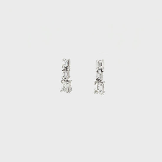 Emerald Cut Diamond Drop Earrings, sophisticated jewelry, elegant diamond earrings, sparkling gemstone drops, luxurious emerald-cut design, exquisite jewelry accessories, statement earrings, fine craftsmanship, glamorous diamond jewelry, radiant gemstone drops, timeless and refined style.