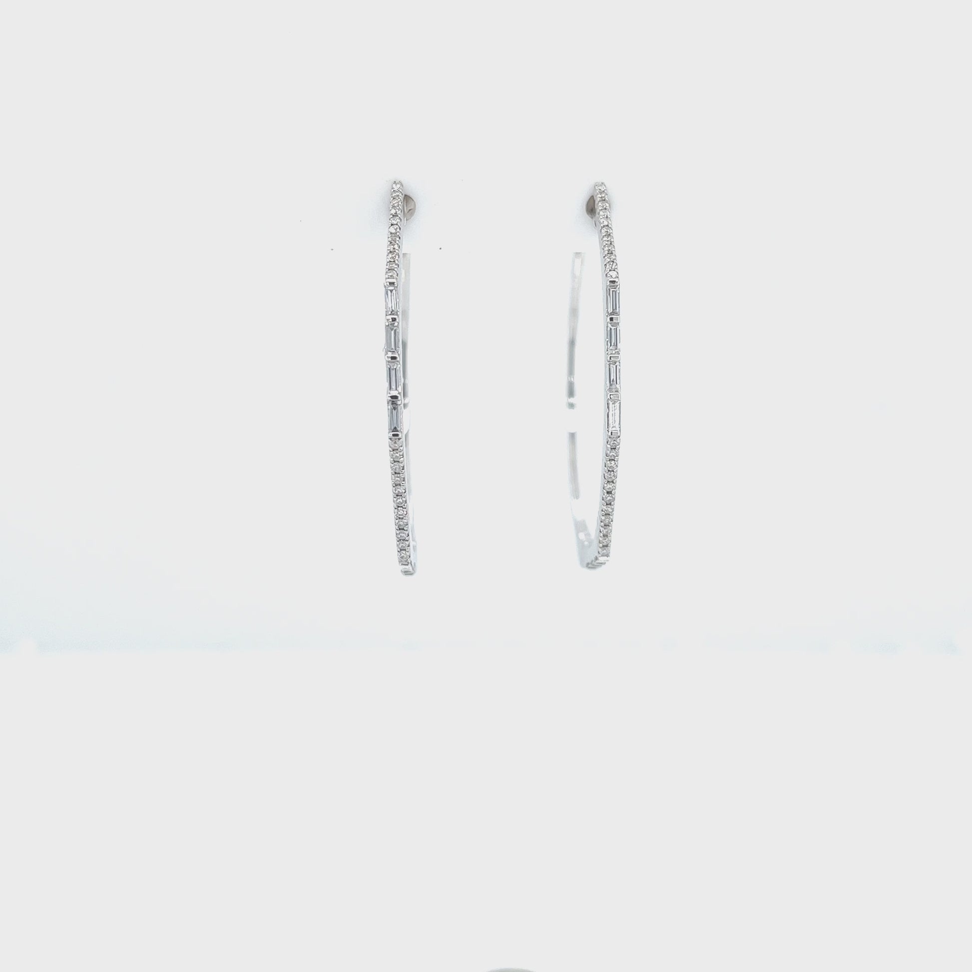 Round brilliant diamond hoop earrings, sparkling and elegant jewelry, baguette diamonds in hoops, glamorous and sophisticated earrings, fine craftsmanship in diamond hoop design.